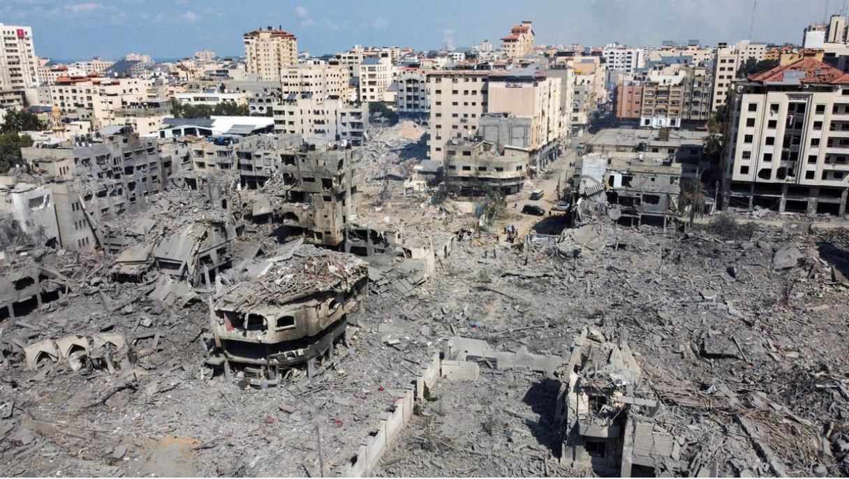 Devestated, gray bombed out landscape of pulverized buildings.
